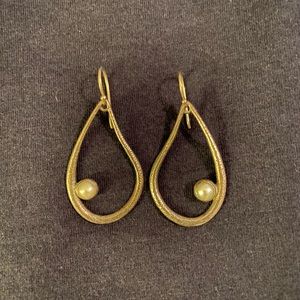 hoop earring with pearl.